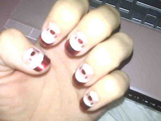 Illustration for article titled Fists Pumpin' And Christmas-Themed Acrylic Nails